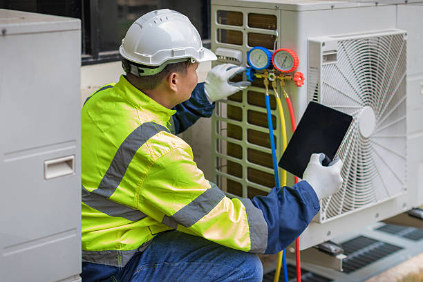 Professional Air Conditioning Repair technician working in Luebbering, MO